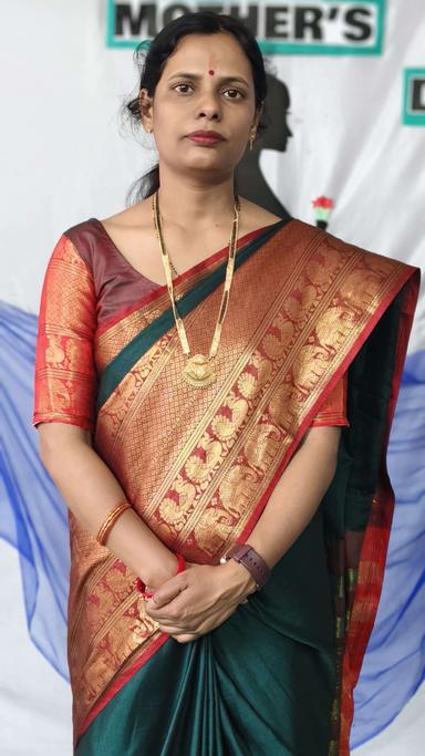 Principal of Edubrain Global Academy in the school auditorium